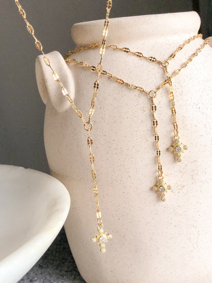 Cross lariat
