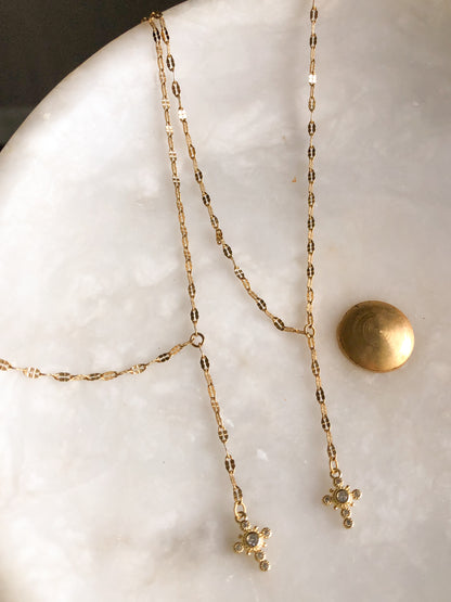 Cross lariat